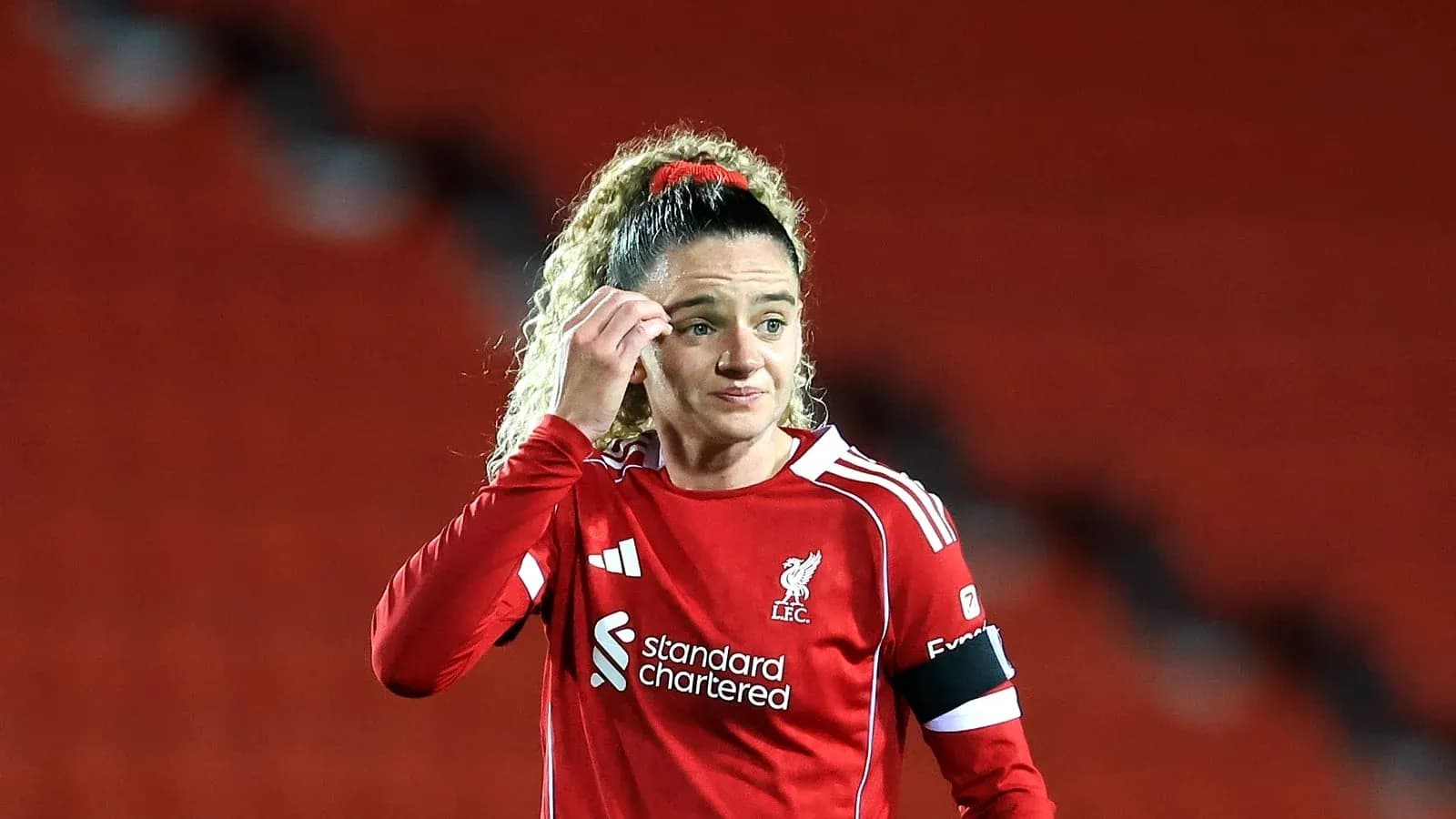 Player in red Liverpool kit on the field