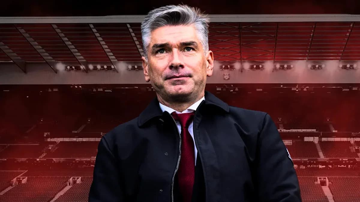 Coach standing in stadium with red background