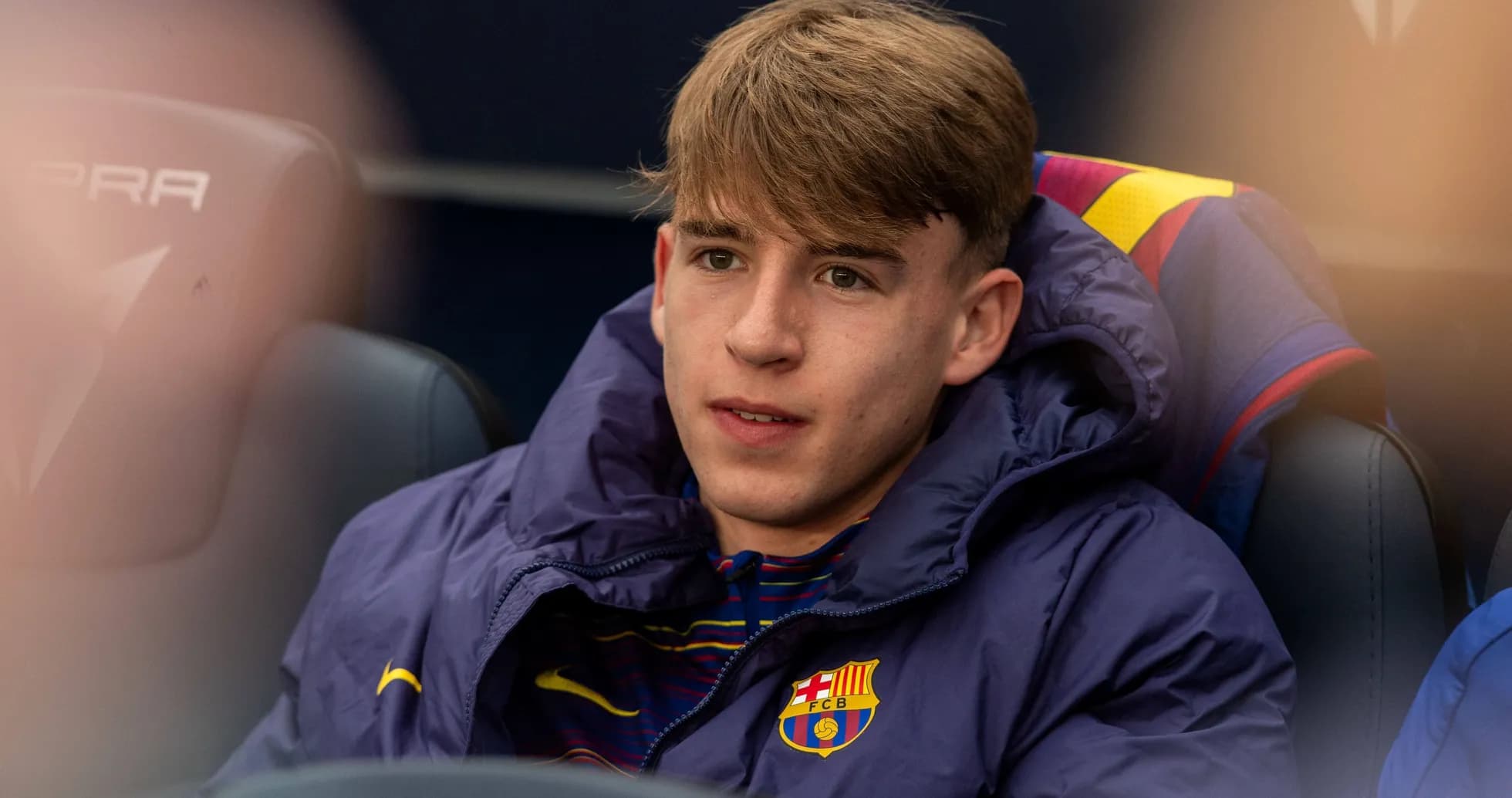 Barcelona player sitting on the bench during match