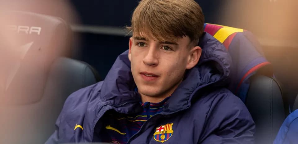 Barcelona player sitting on the bench during match