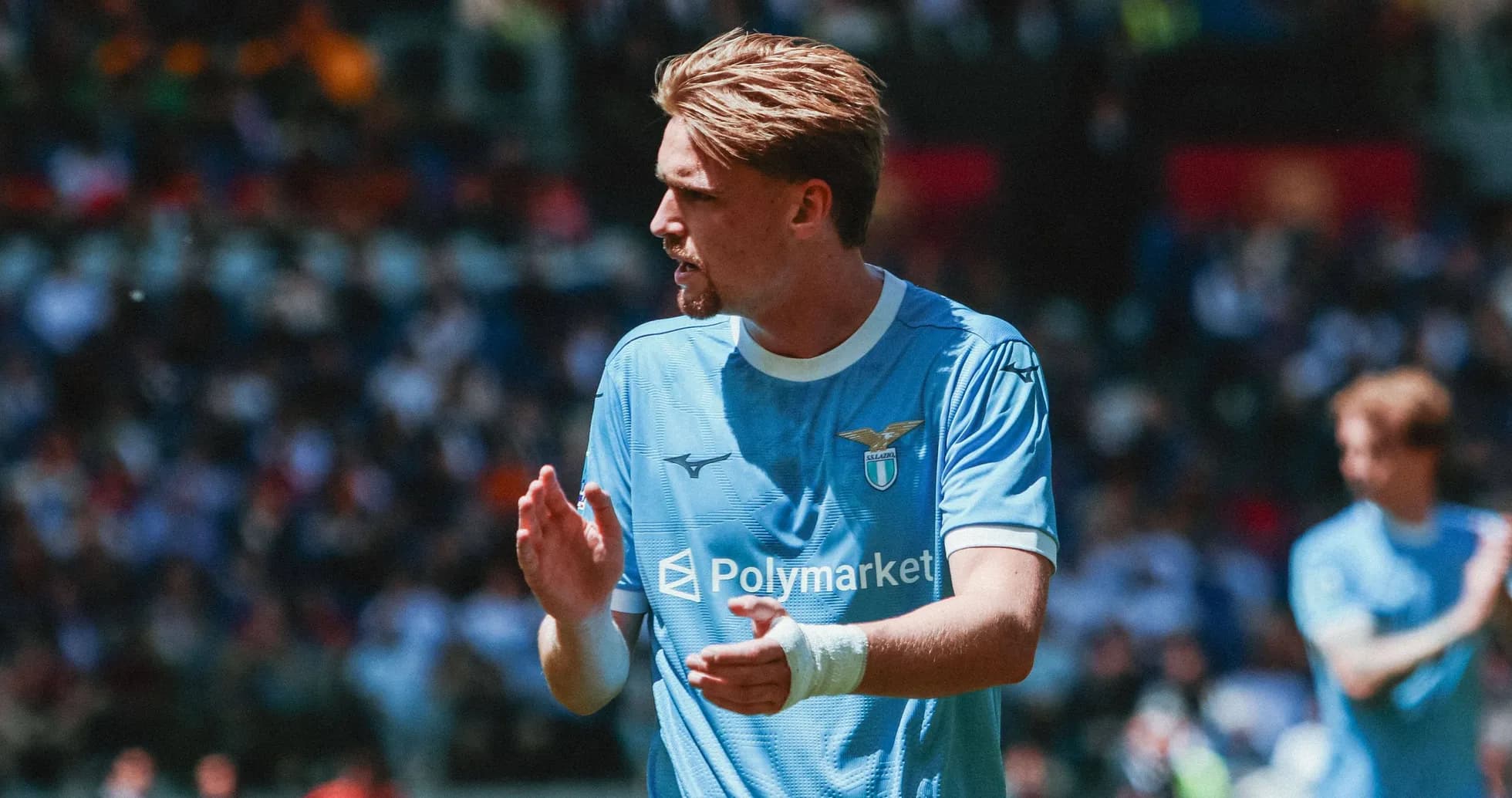 Lazio player applauding during match on field