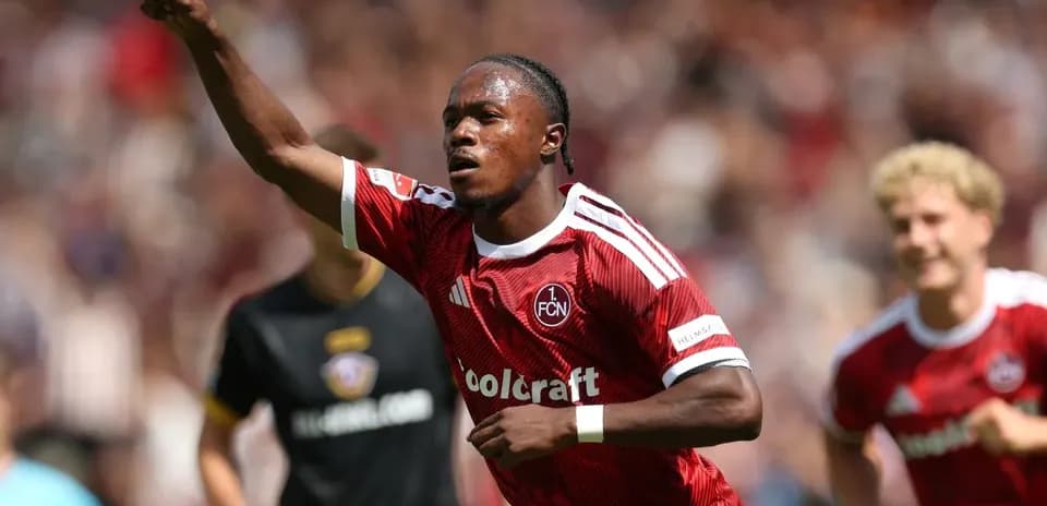 Player celebrating a goal in red team jersey
