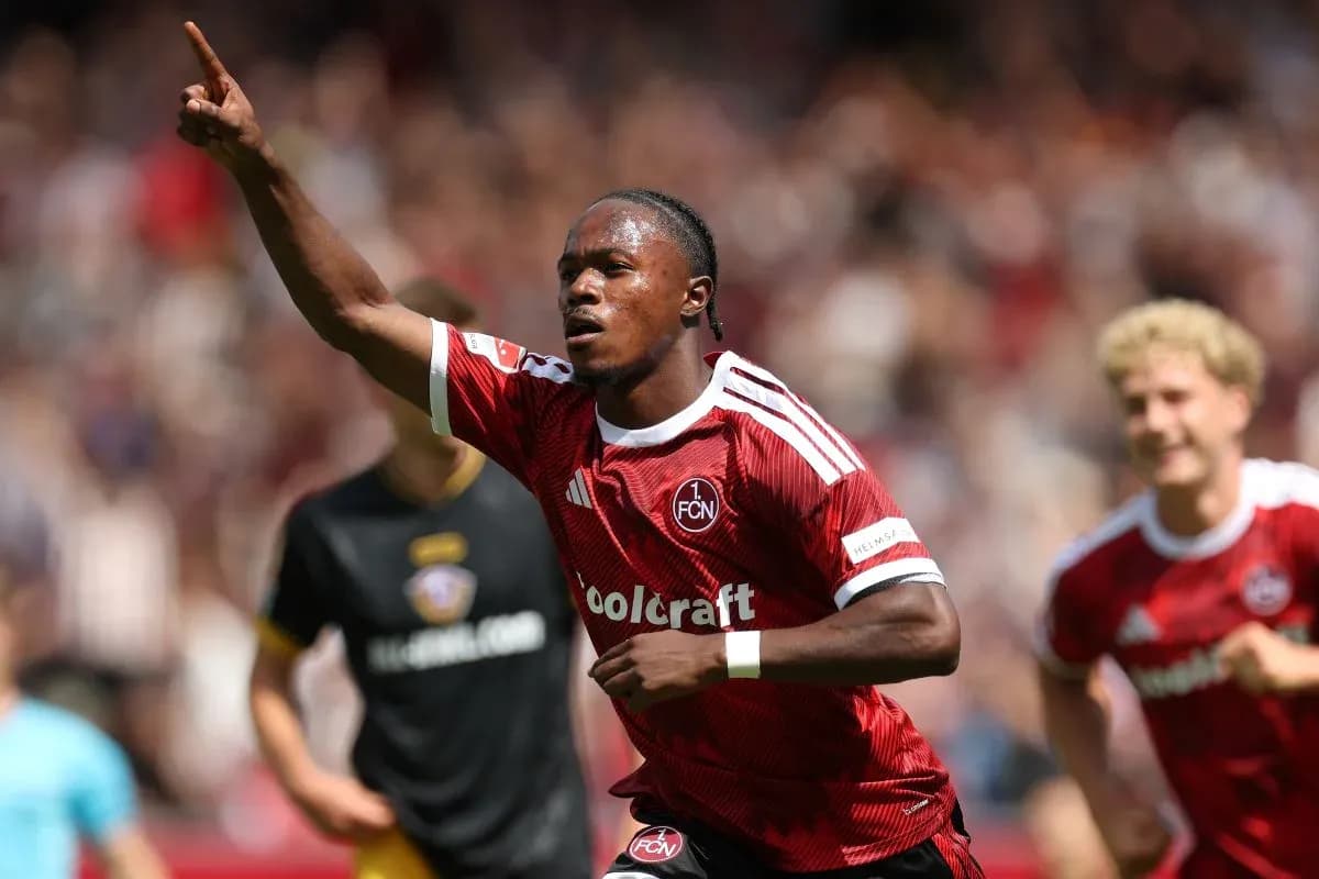 Player celebrating a goal in red team jersey