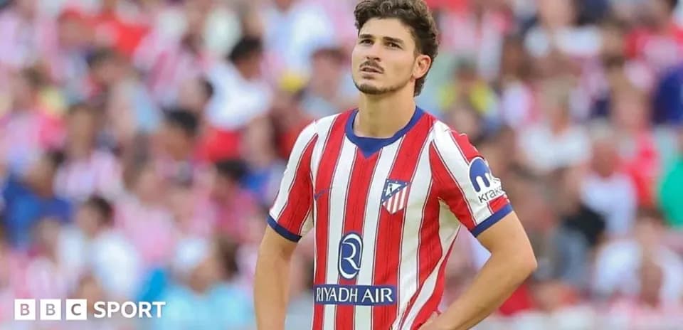 Atletico Madrid player looking thoughtful on field