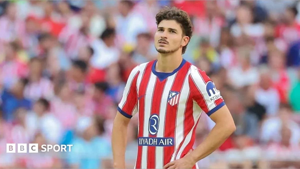 Atletico Madrid player looking thoughtful on field