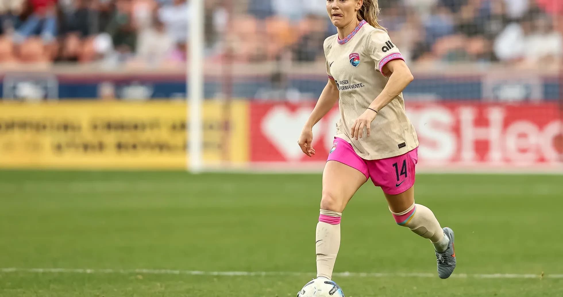 Player dribbling ball during Houston Dash match