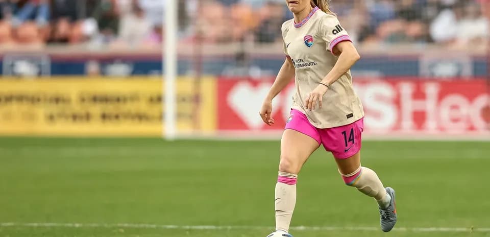 Player dribbling ball during Houston Dash match