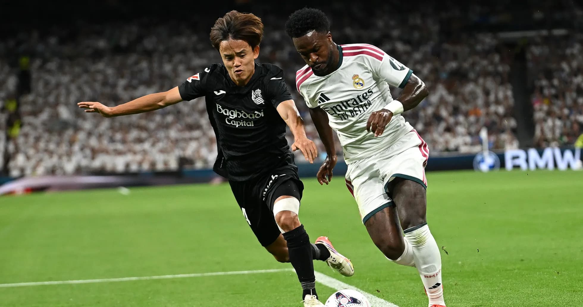 Two players competing for the ball during match