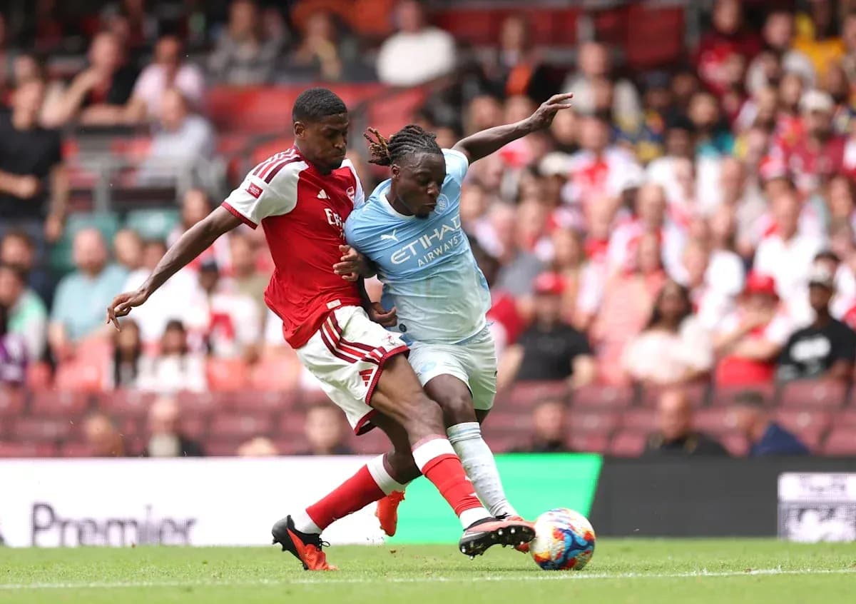 Two players contesting the ball during match