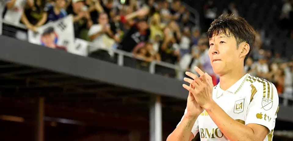 Player applauding fans after a match