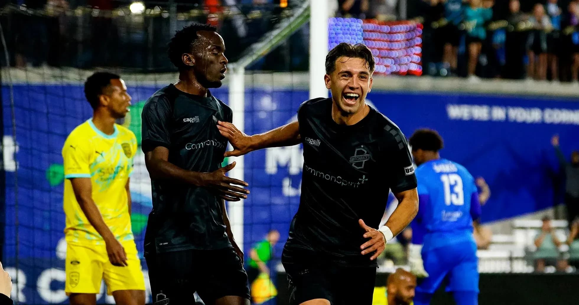 Players celebrating a goal in USL Championship match