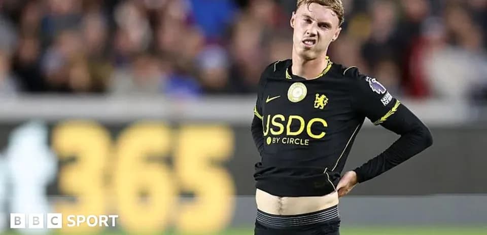 Player adjusting his shirt during match action