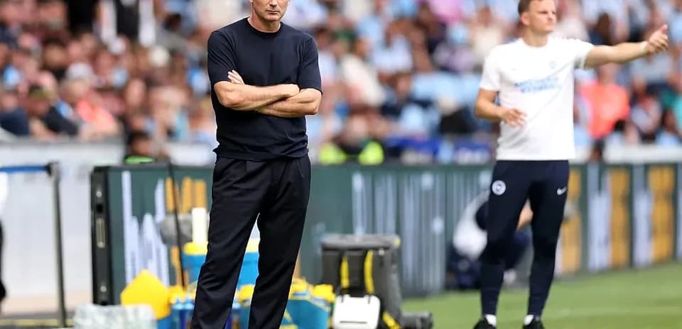 Coaches on the sidelines during a football match