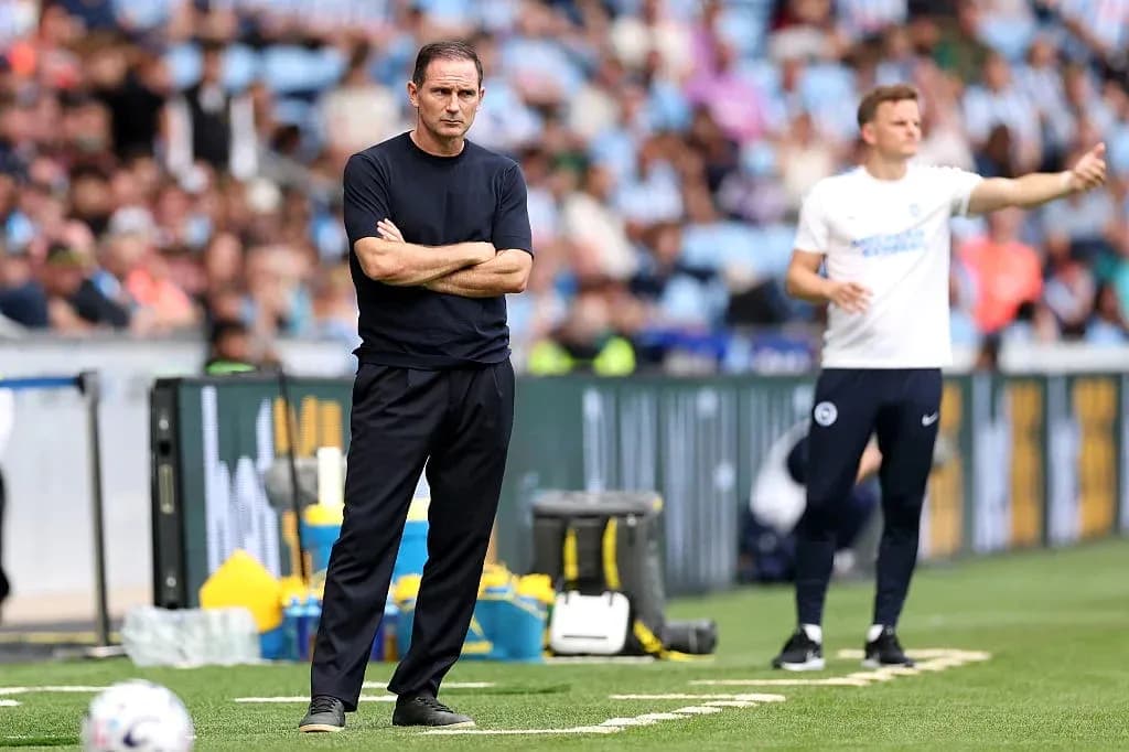 Coaches on the sidelines during a football match