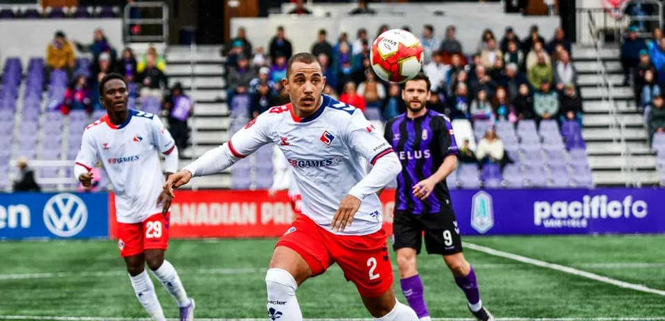 Players competing during Supra du Quebec vs Pacific FC match