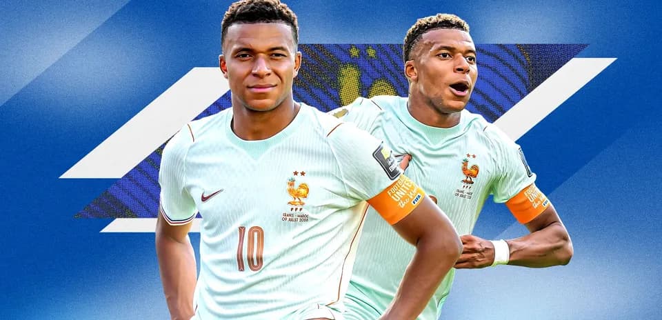 Two players in France kits celebrating a goal