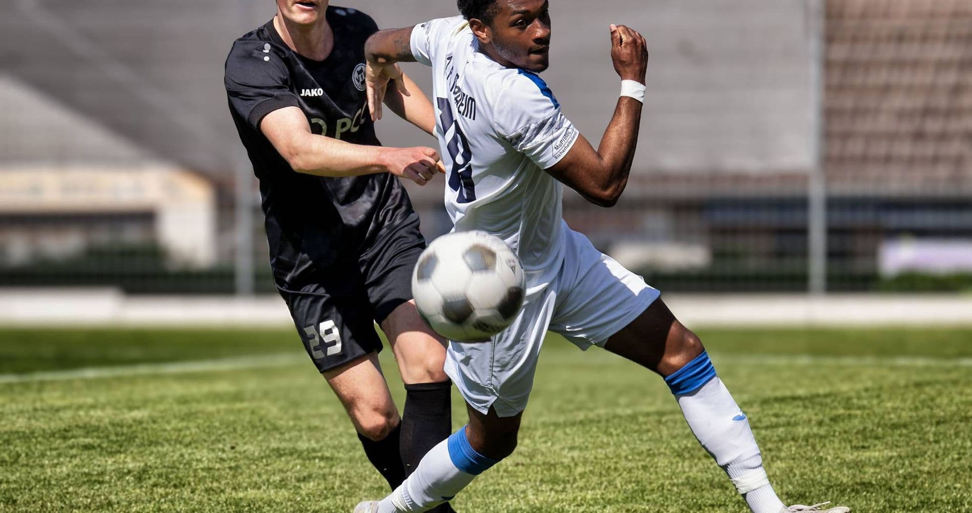 Player kicking ball during Monheim vs Germania Ratingen match