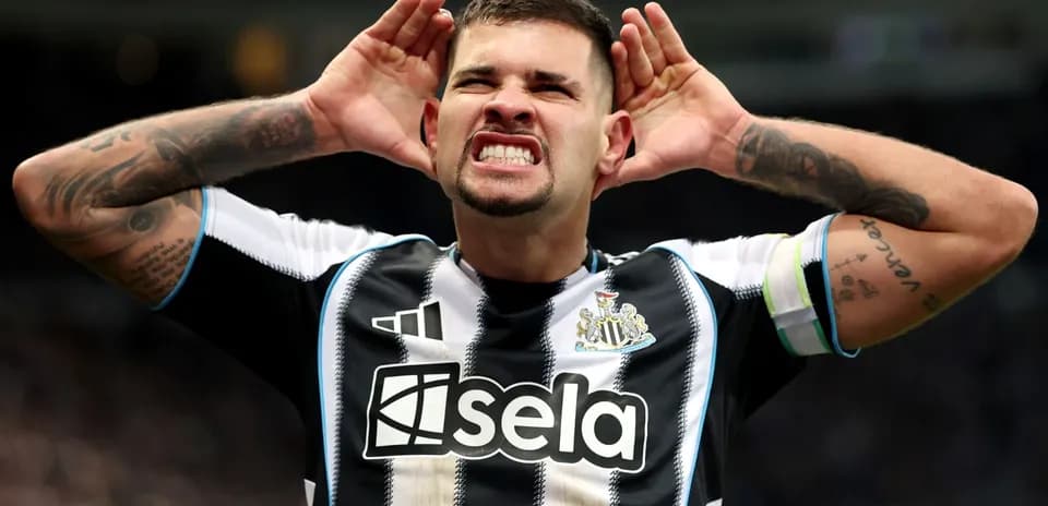 Player celebrating with hands on ears after scoring