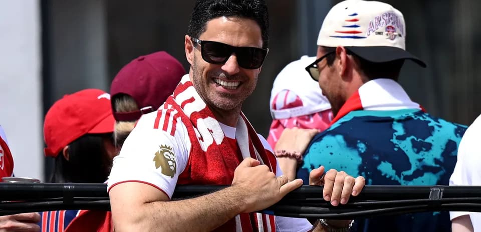 Person wearing sunglasses and a scarf at celebration