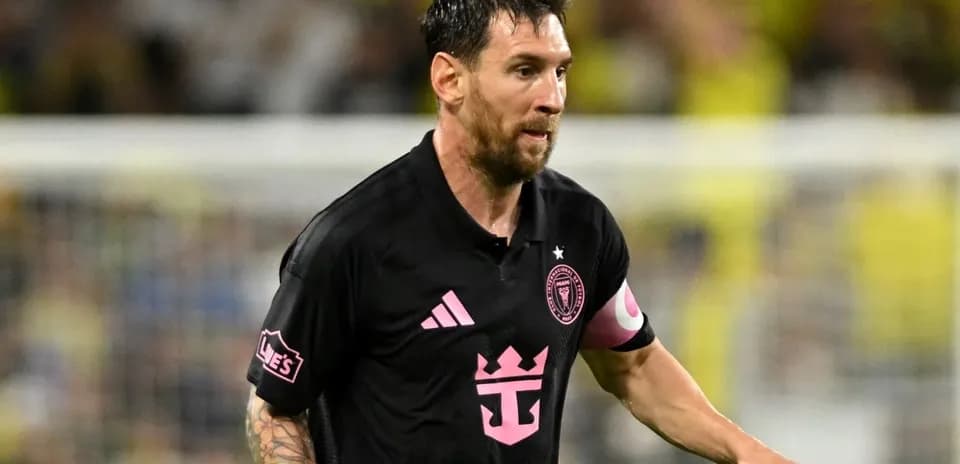 Player in black jersey running during soccer match
