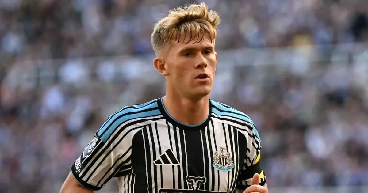 Player wearing Newcastle United kit on the pitch