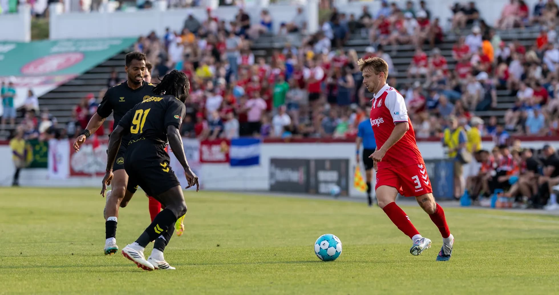 Players competing for the ball during match