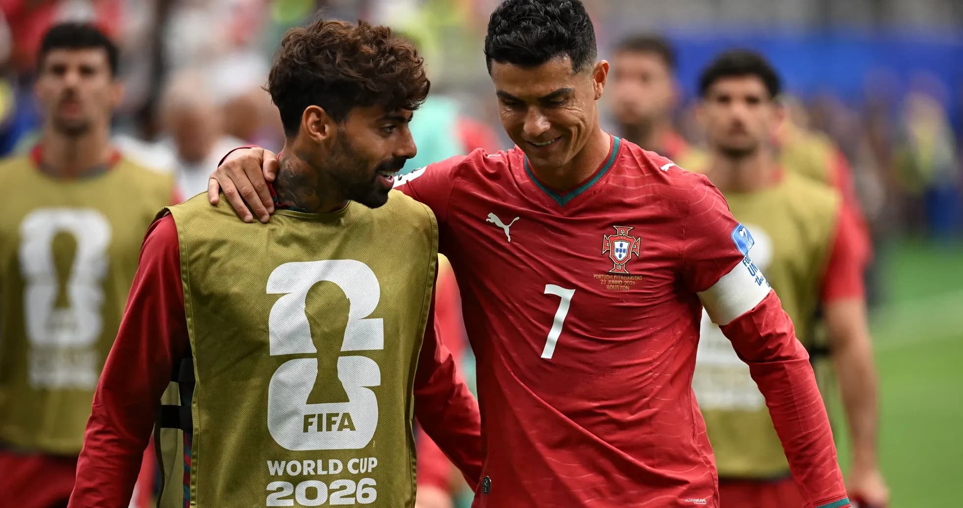 Two players walking together during warm-up session