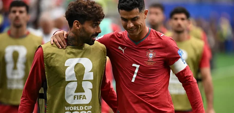 Two players walking together during warm-up session