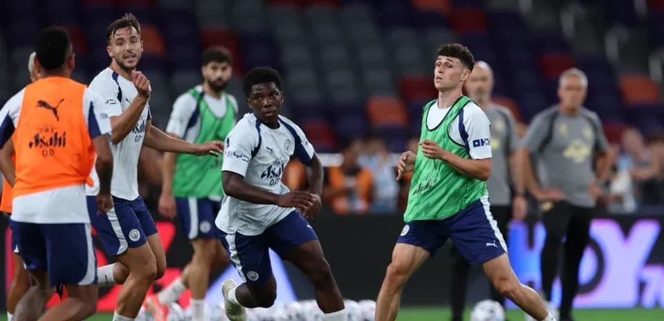 Players training and passing ball during practice session