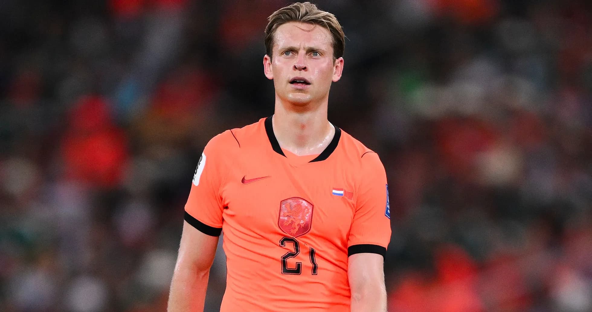 Player in orange jersey during football match