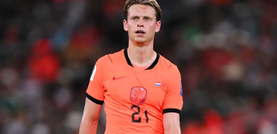 Player in orange jersey during football match
