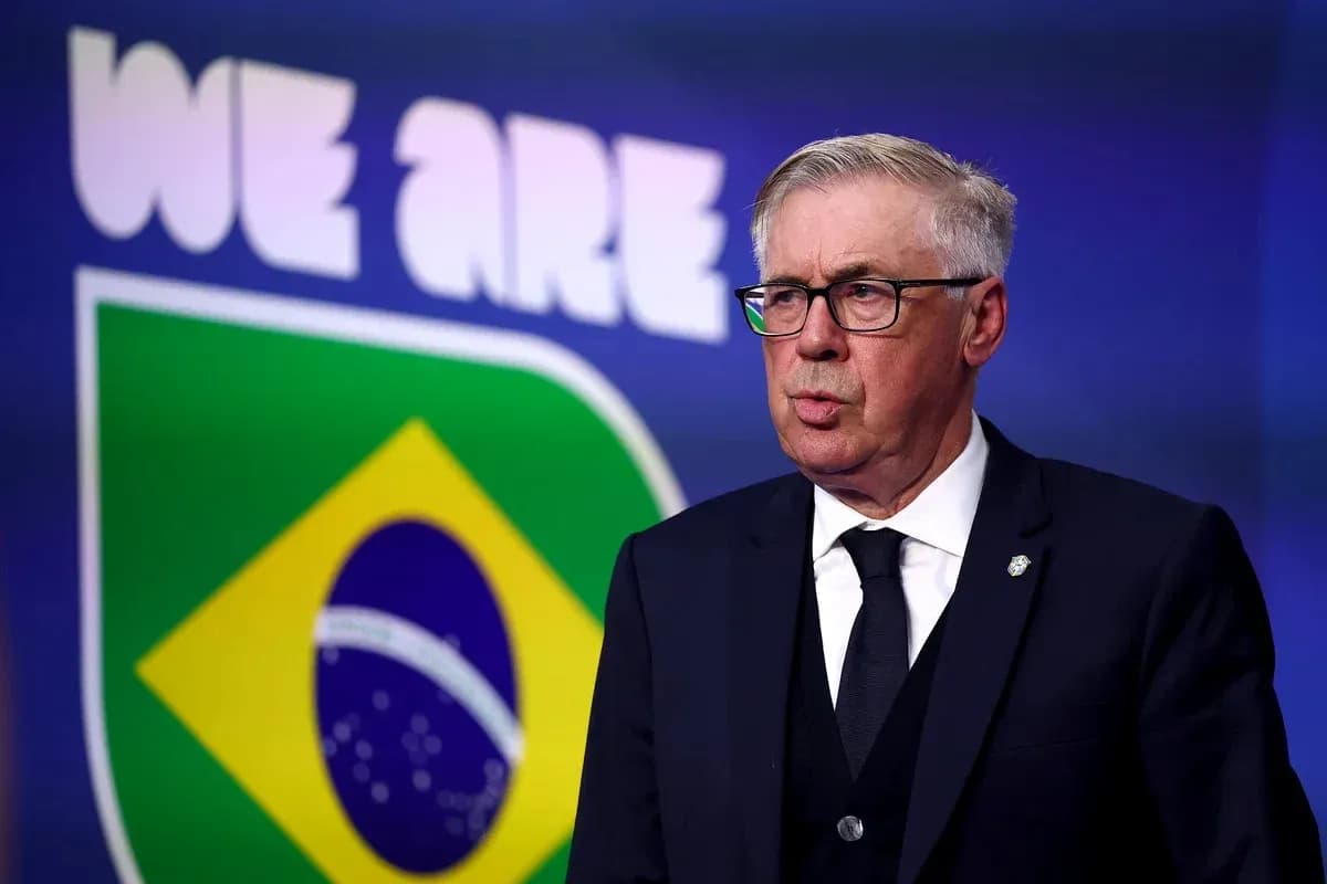 Manager speaking at press conference with Brazil flag backdrop