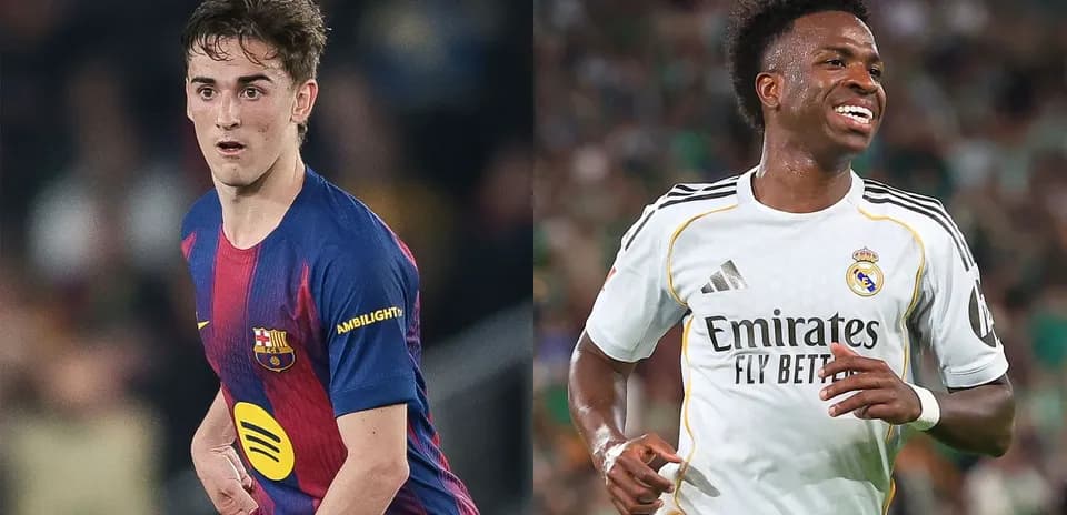 Barcelona and Real Madrid players during match action