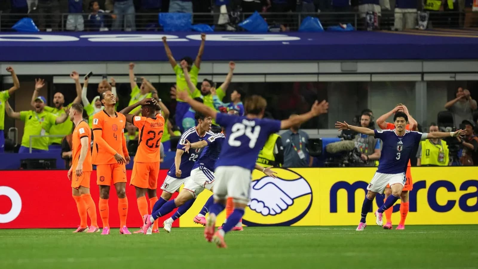 Players celebrating during Netherlands vs Japan match