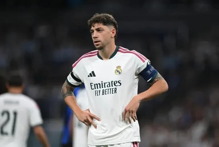 Real Madrid player with captain's armband on pitch