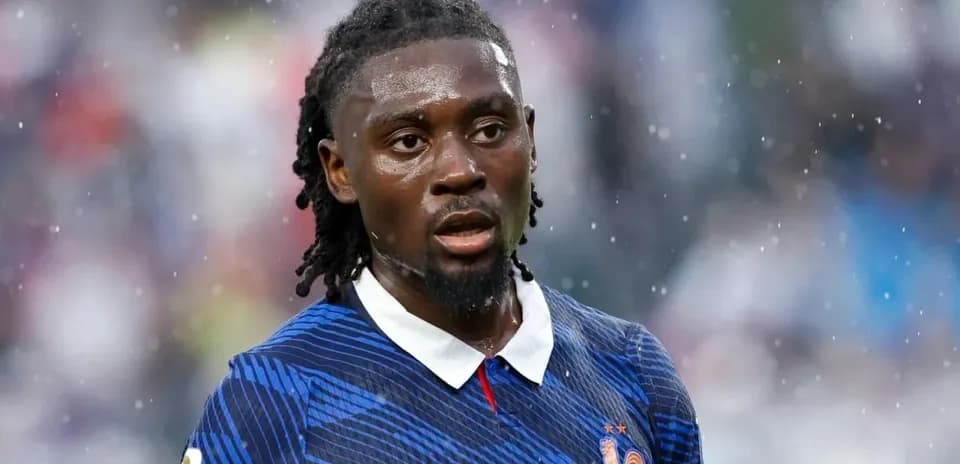 Player wearing France kit during rainy match