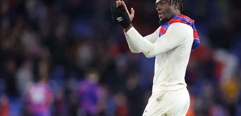 Player applauding fans after match at stadium
