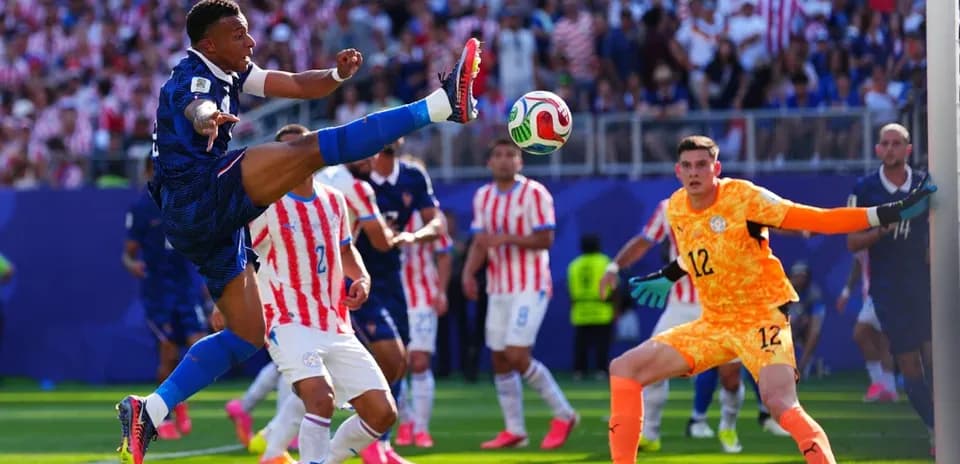 Player attempting to kick the ball near goal