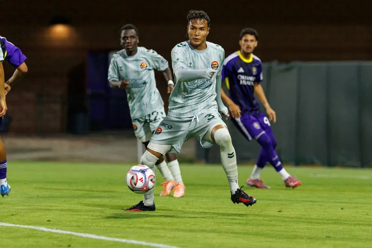 Player passing the ball during MLS Next Pro match