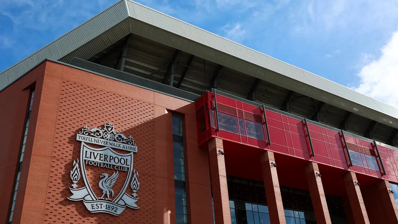 Exterior view of Anfield stadium with Liverpool FC logo