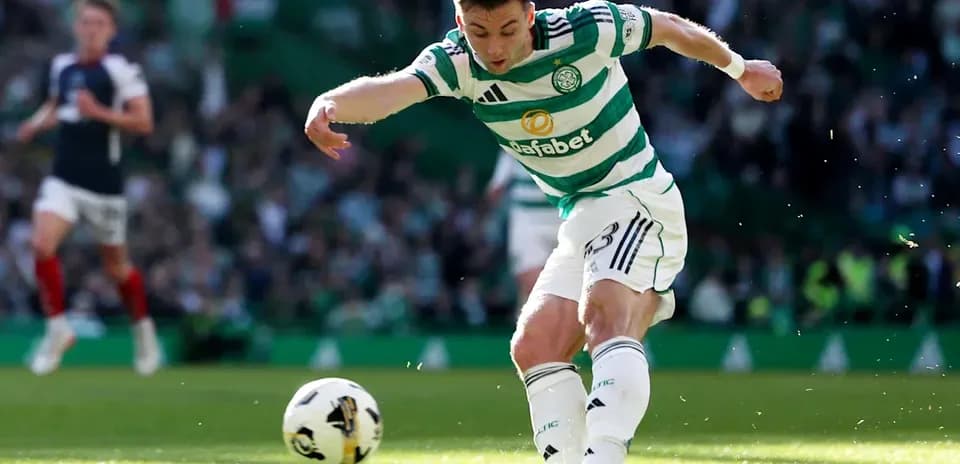 Celtic player kicking ball during match at stadium