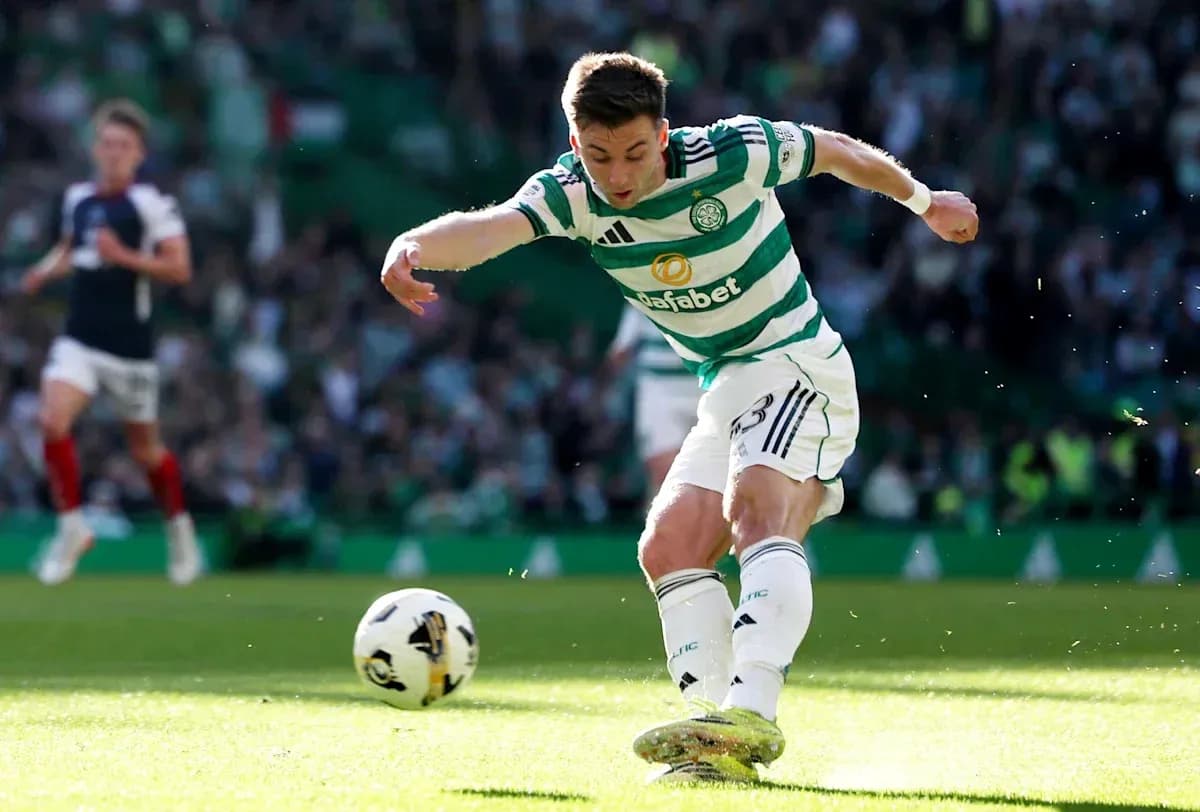 Celtic player kicking ball during match at stadium