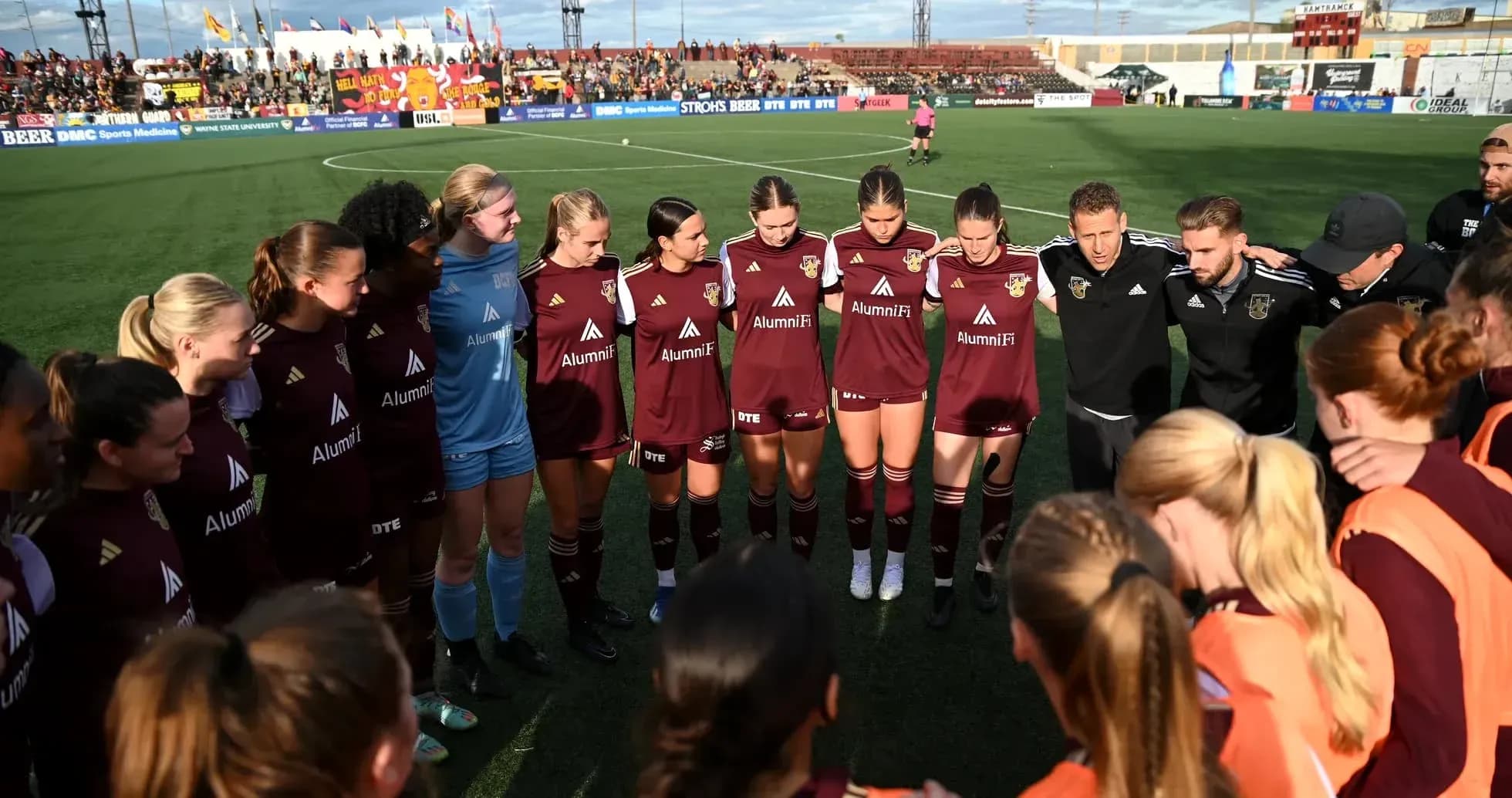 Detroit City players in huddle before match