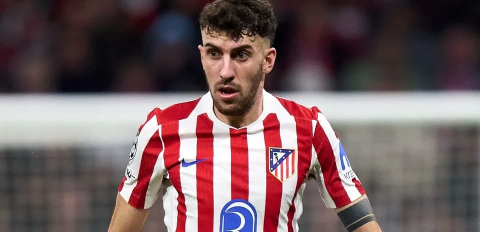 Player in red and white striped jersey during match