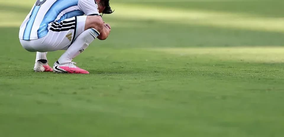 Player kneeling on the pitch during a match