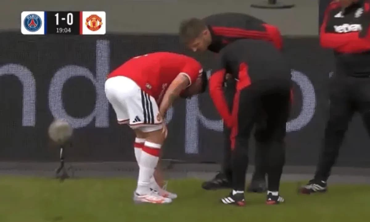 Player receiving medical attention on the sidelines