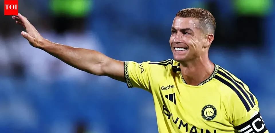 Player in yellow jersey waving to fans