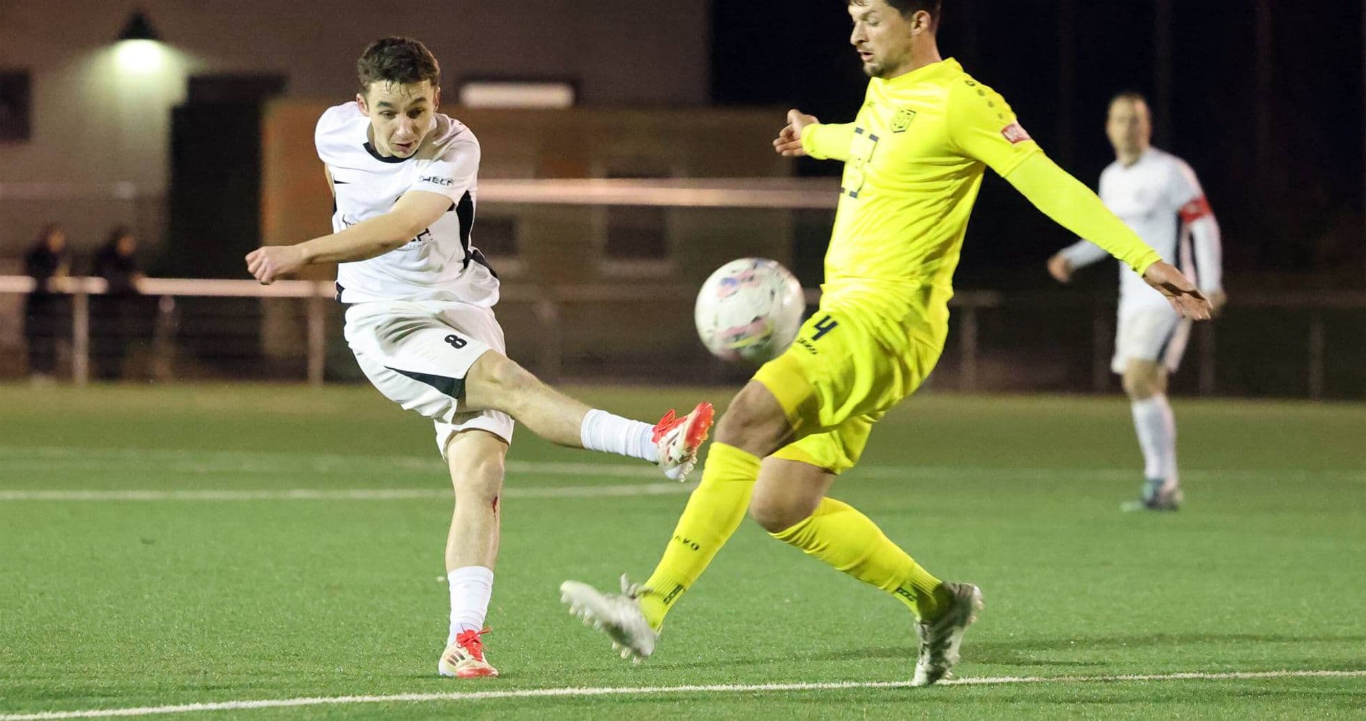 Player kicking ball during SC St. Tönis match