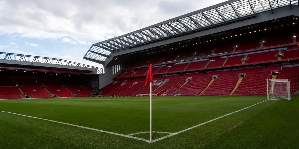 Corner flag in empty stadium with red seats