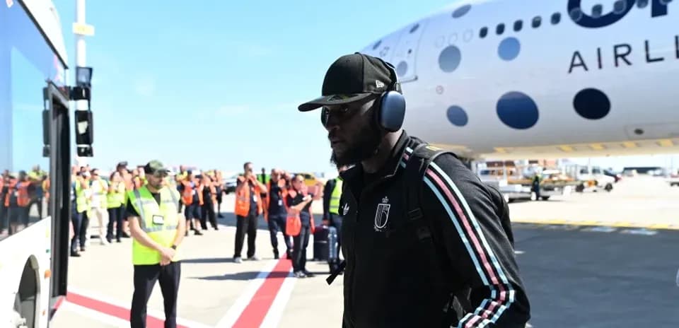 Player arriving at airport near aircraft